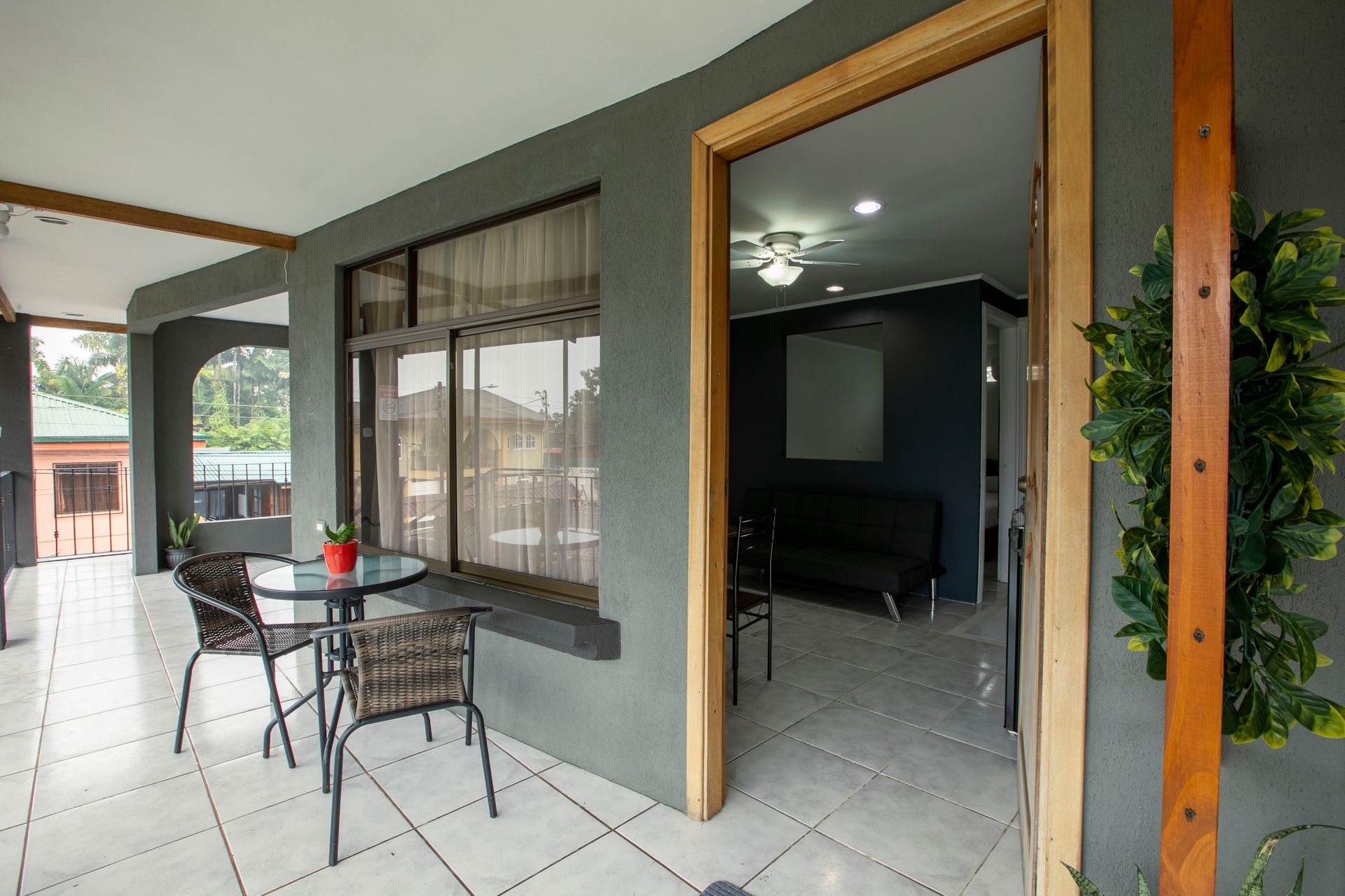 there is a patio with a table and chairs on it .