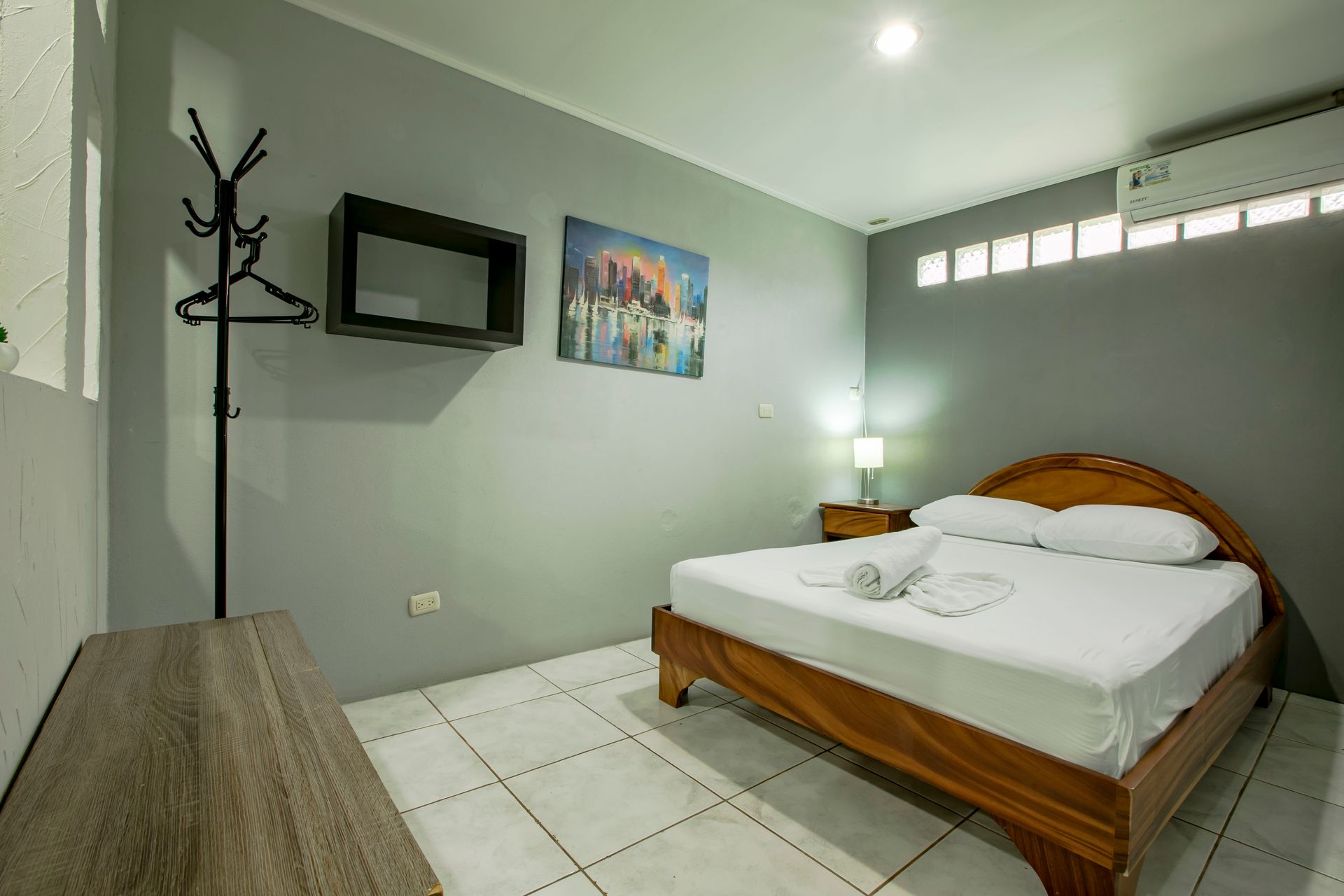 a bedroom with a king size bed and a television .