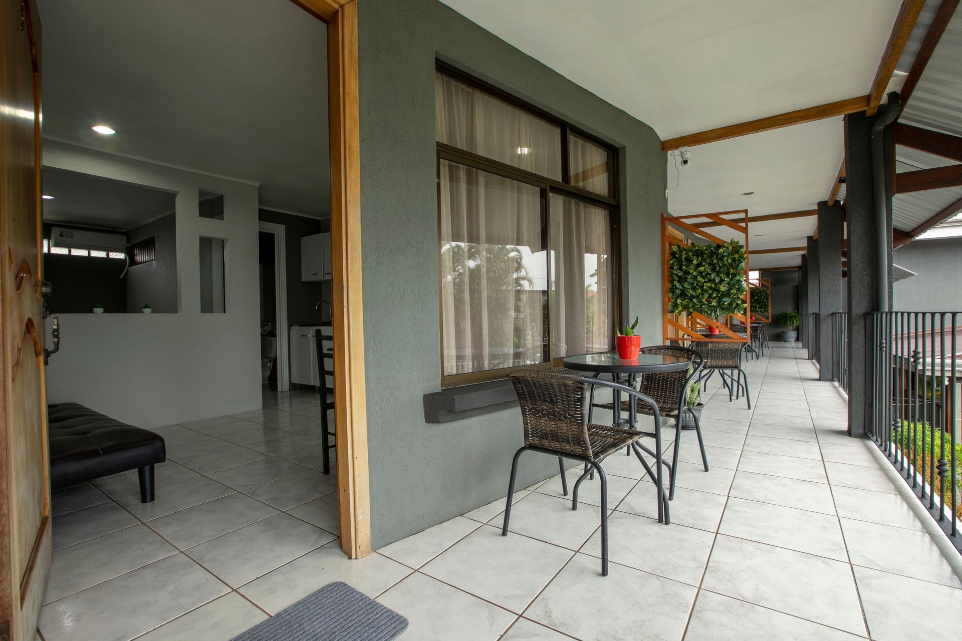 a balcony with a table and chairs in a hotel room .