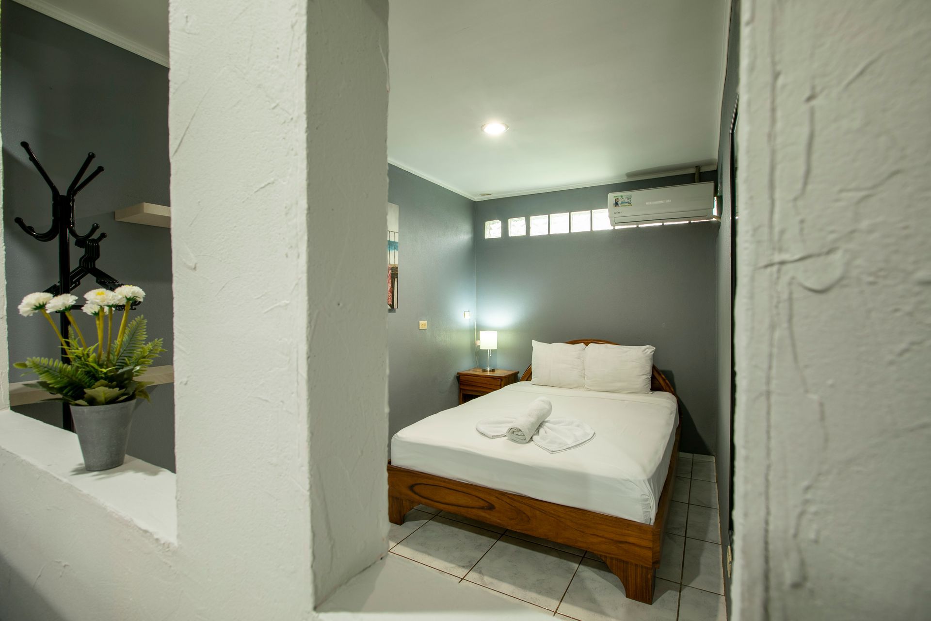 there is a bed in the middle of the room .