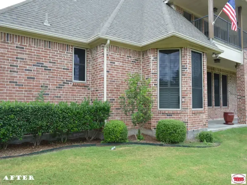 A picture of a brick house before and after being painted
