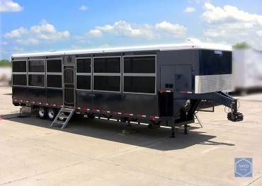 A large trailer is parked in a parking lot.