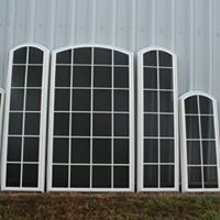 A row of windows sitting next to each other on the side of a building.