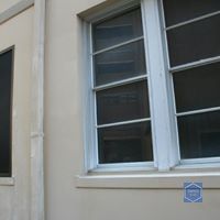 A close up of a window on the side of a building.