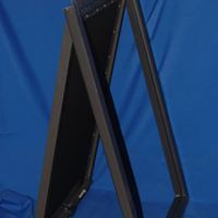 A picture frame is sitting on top of a blue table.