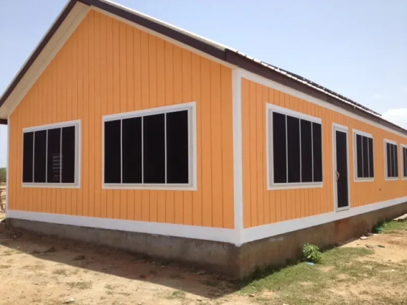 An orange and white house with black windows