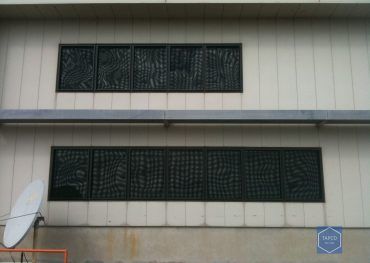 A building with a satellite dish on the side of it