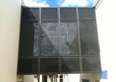 A metal wall with a picture of a woman on it.