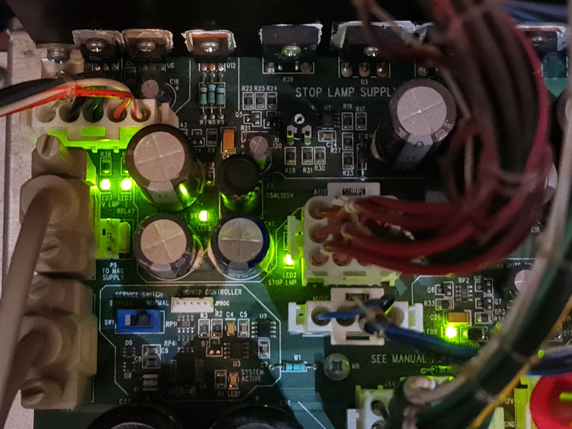 Person tuning a piano with a tool; close-up of hands and interior mechanics.