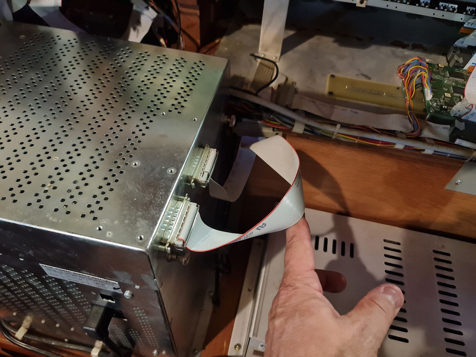 Grand piano in a bright room with large windows overlooking a mountain view, plants.