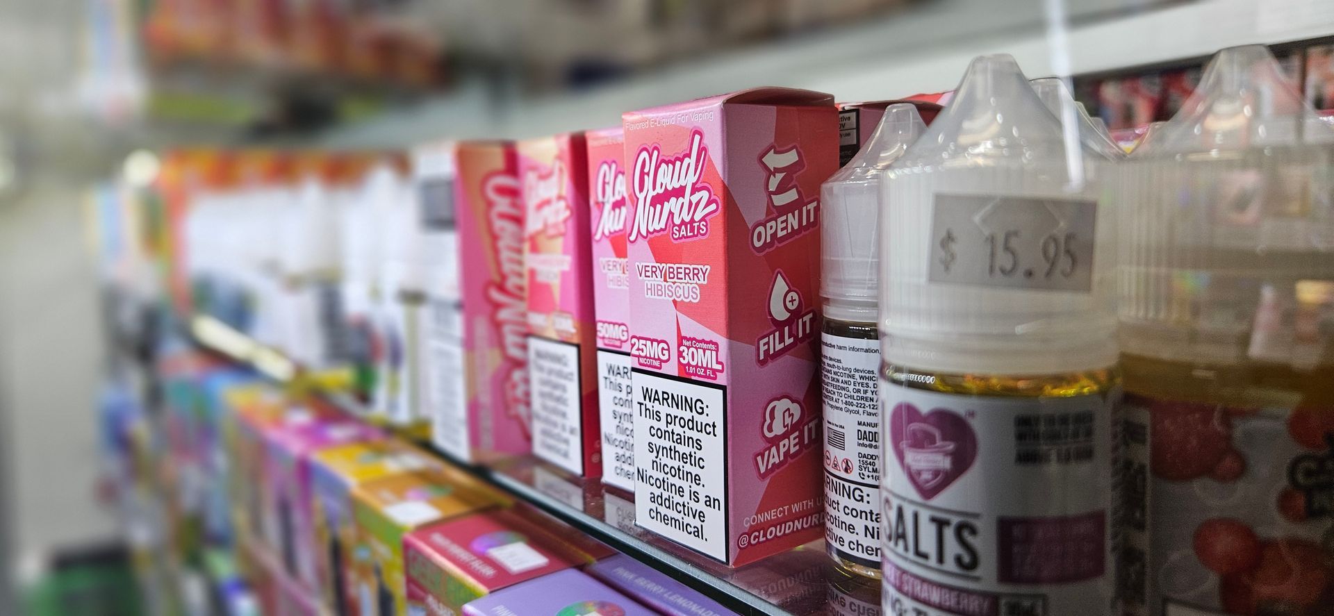 A display of vape juice and nic salt bottles.