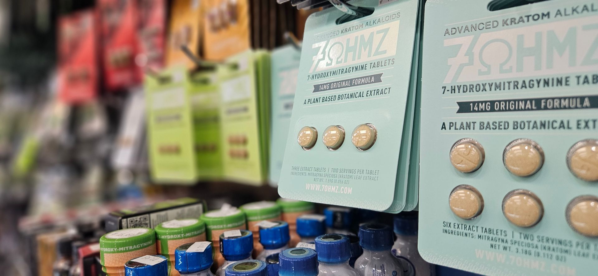 A shelf in Magic Man displaying kratom, kratom extracts and 7oh products.