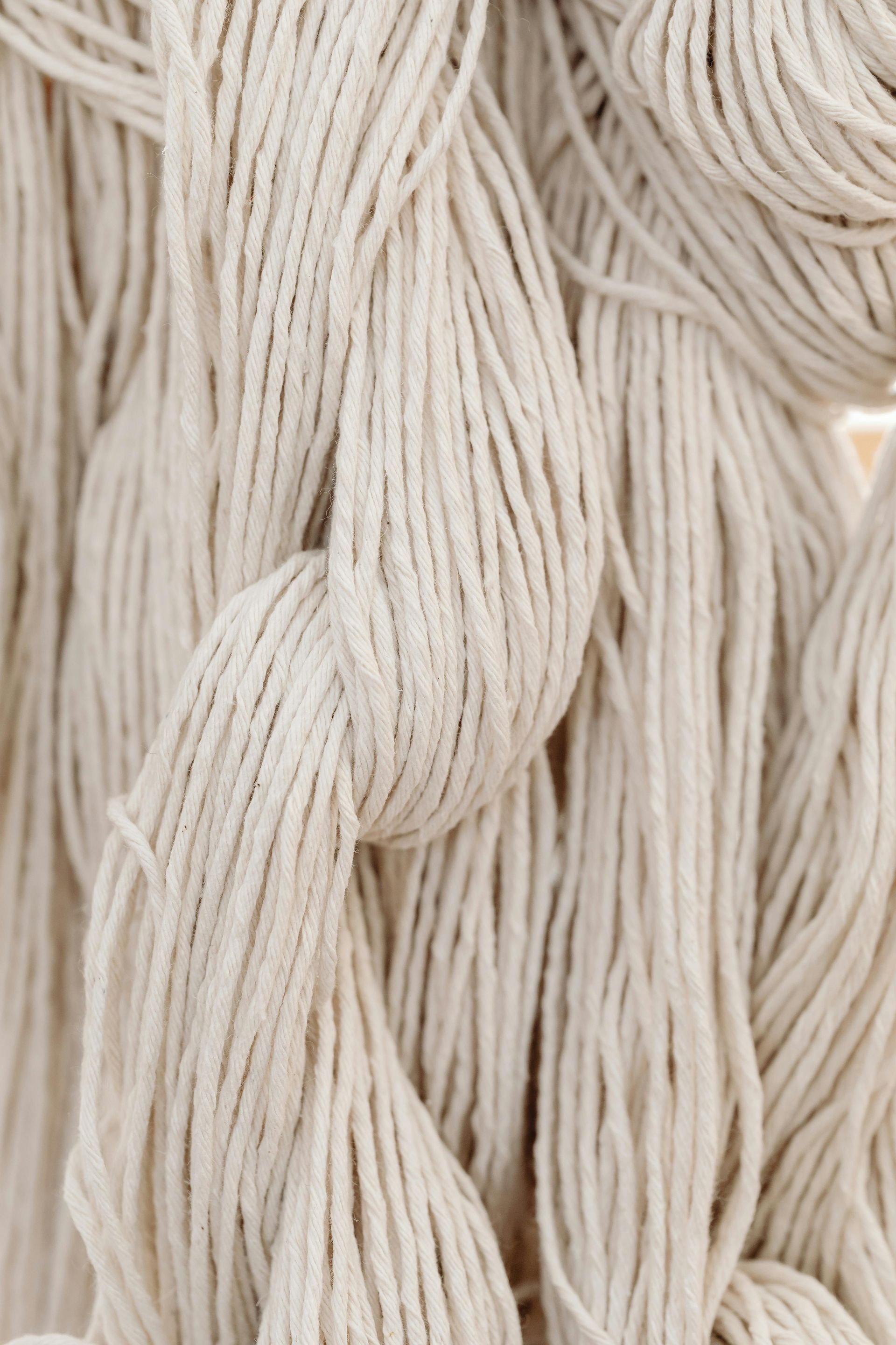 A close up of a bunch of white yarn/cotton