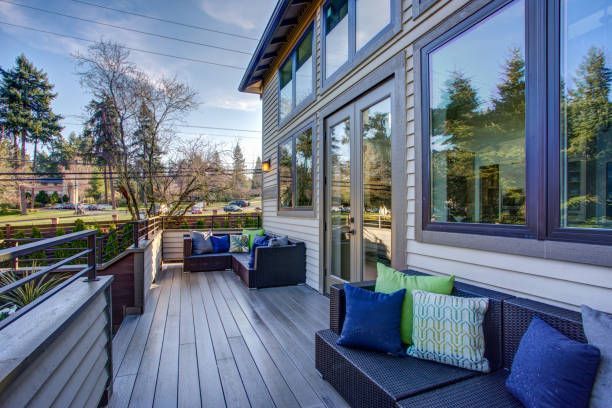 The home exterior features a luxurious, oversized custom deck