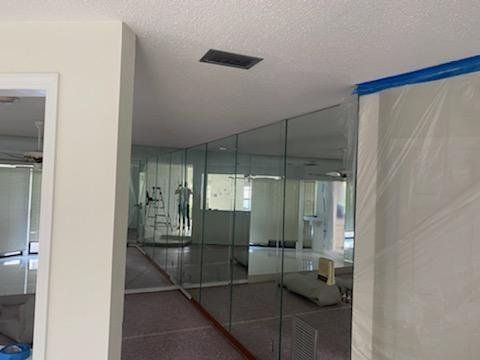 A room with a lot of mirrors on the wall.