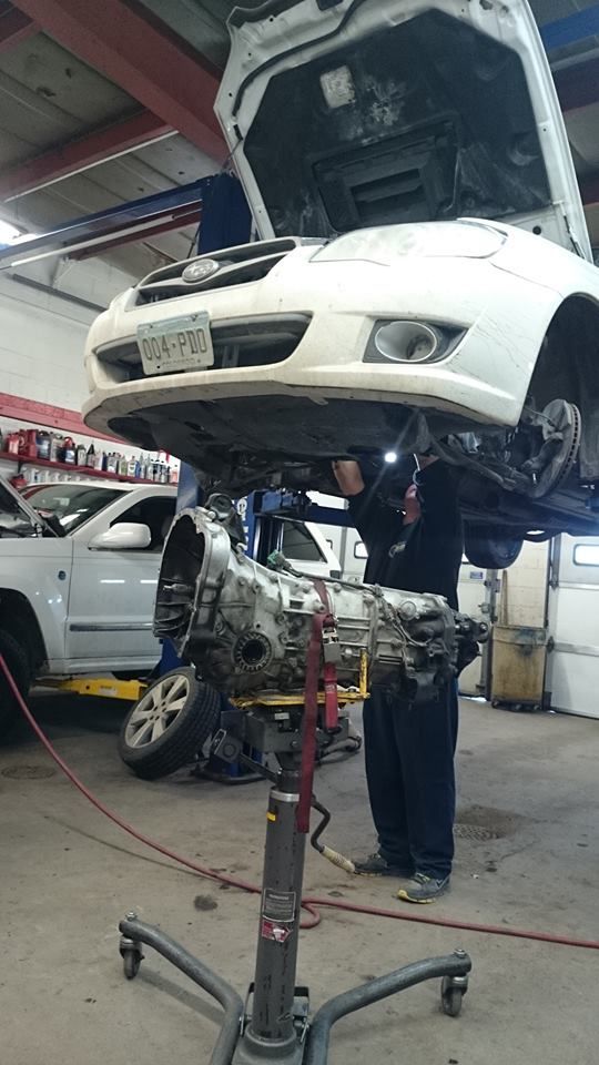 Car on a Lift Inside an Automotive Repair Shop | Bachman Auto Service & Repair