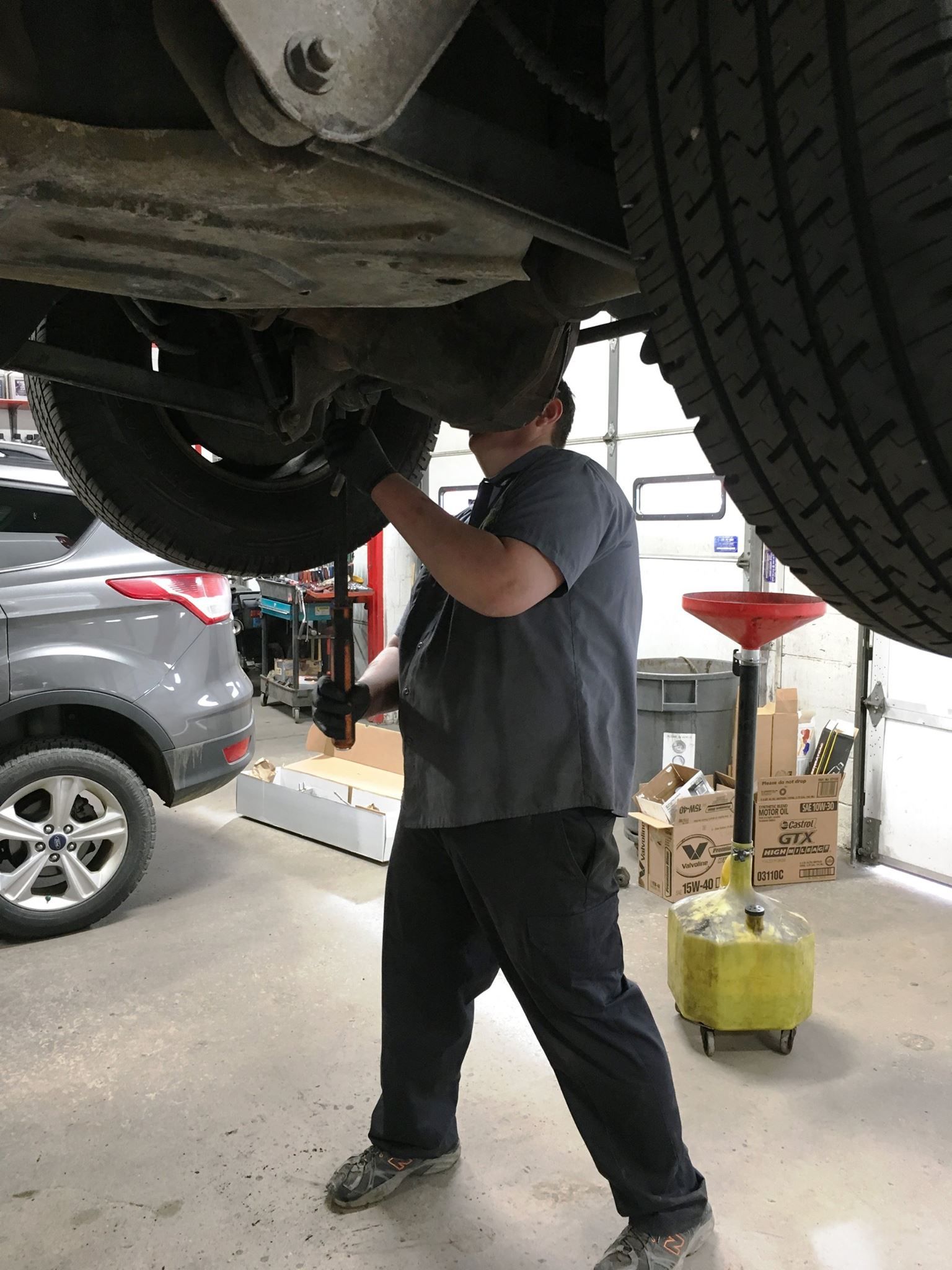 Mechanic Working Under the Vehicle | Bachman Auto Service & Repair
