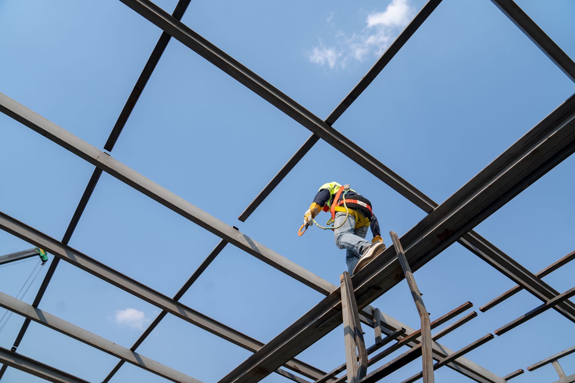 Bathroom with toilet, shower, and shelving unit. The room has a light wood-look floor and beige walls.