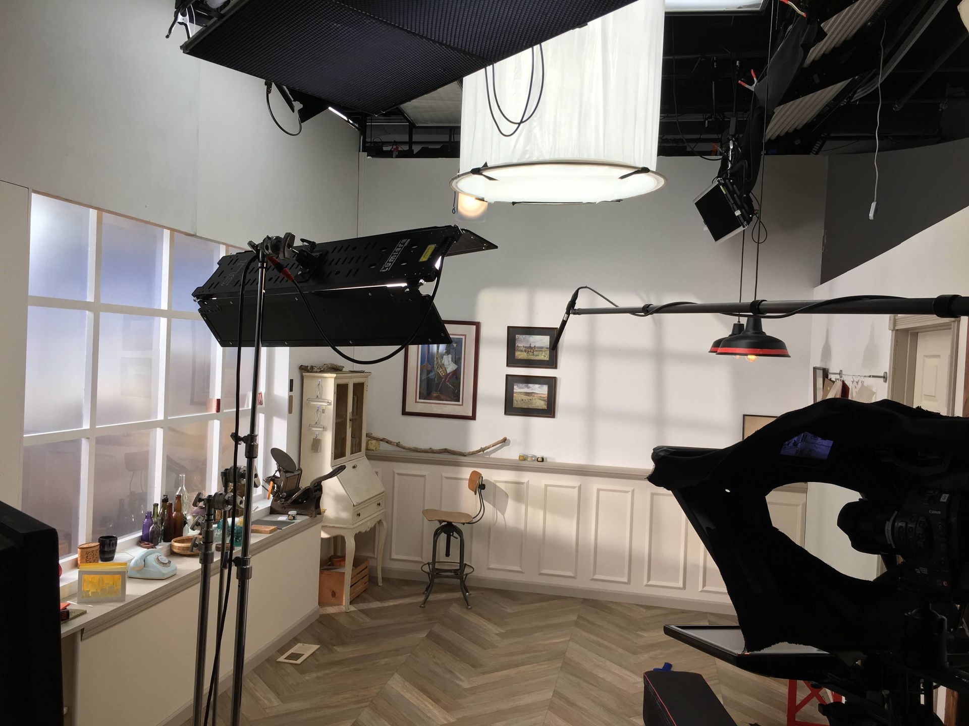 A camera is sitting in a room with a lot of lights