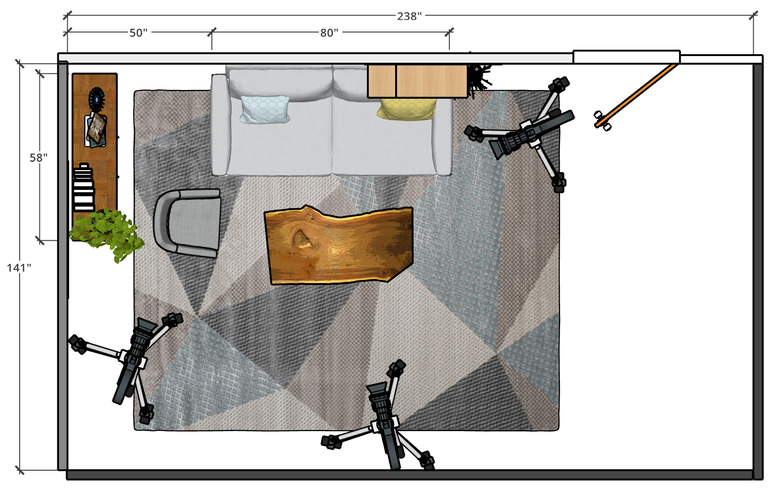 An aerial view of a living room concept with a couch, rug, desk, chairs, and other furniture.