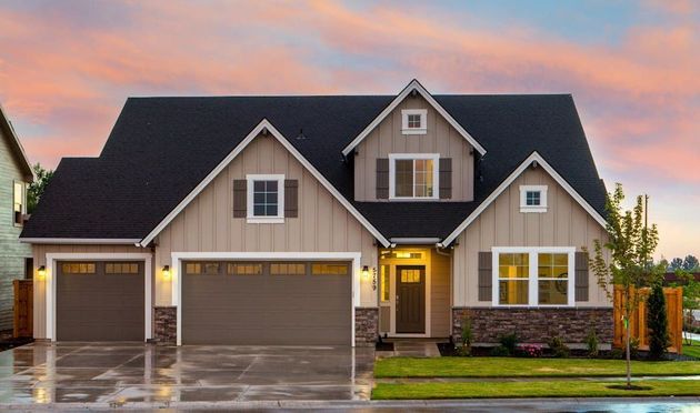 House with sunset and exterior lighting and nice curb appeal