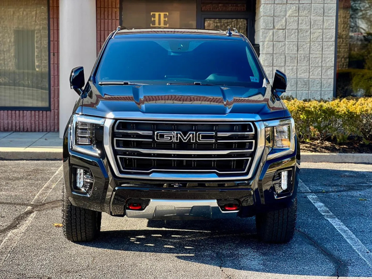 Black GMC Canyon front view with chrome grille and LED headlights after ceramic coating treatment