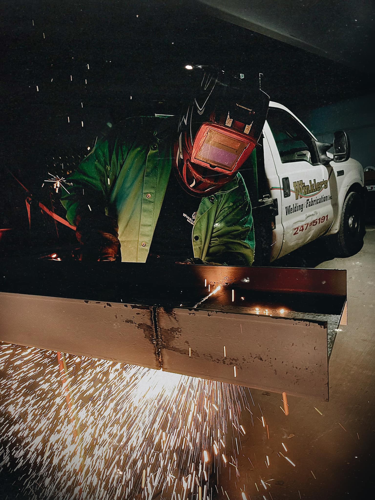 Man Welding a Steel Beam — Baltimore, MD — Winkler's Inc