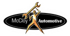 Gold figure holding a wrench above its head, logo for McCloy Automotive.
