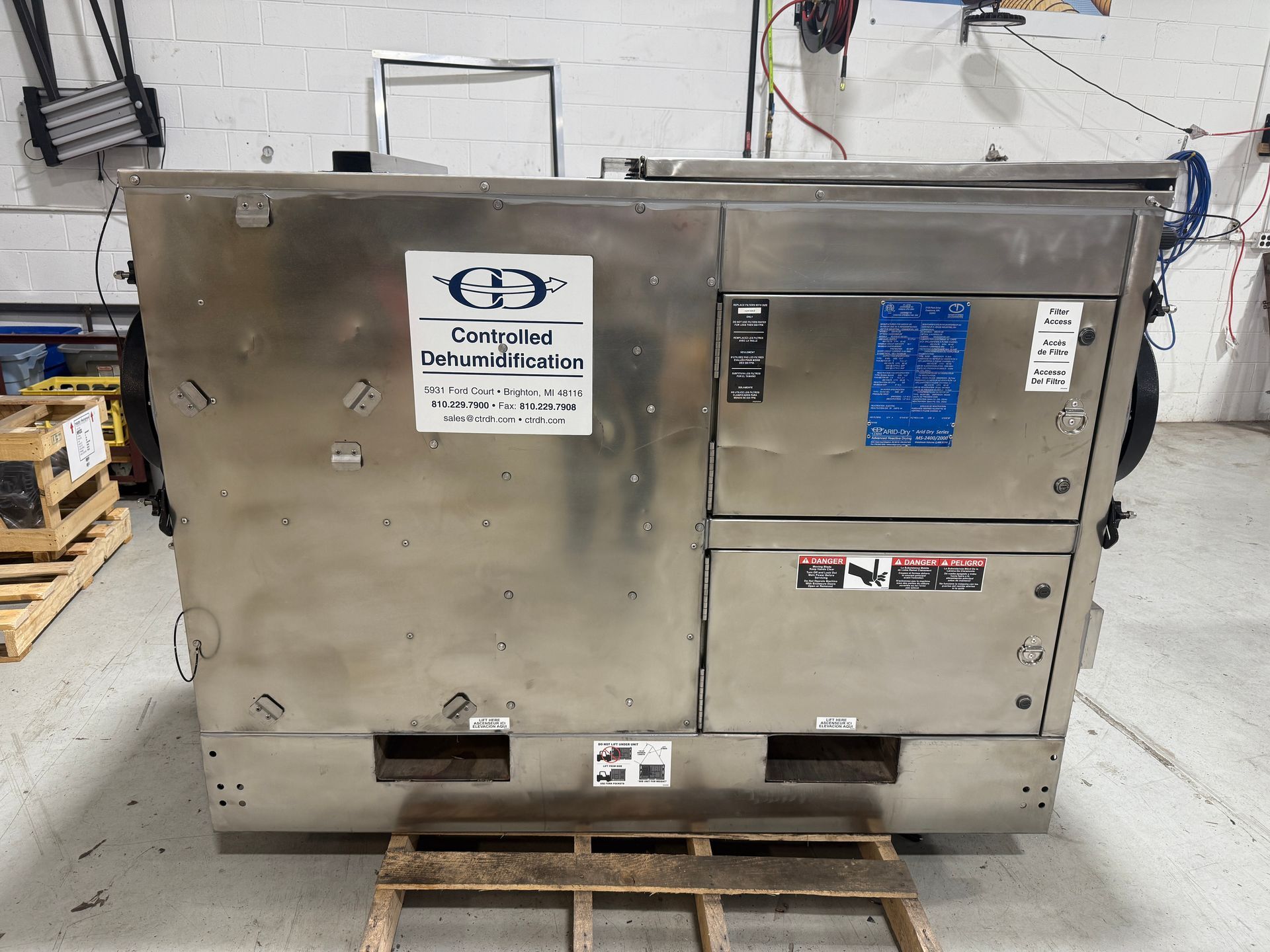 A large metal box is sitting in a warehouse.