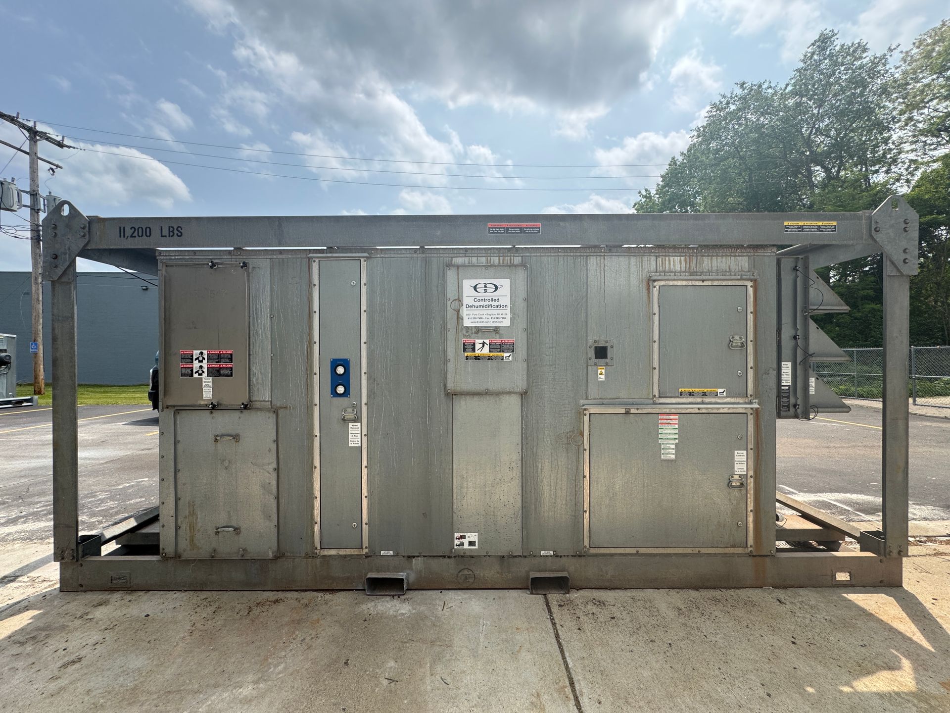 A large metal box is sitting in a warehouse.