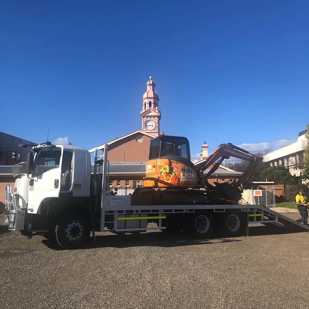 Loader Truck Carrying Excavator — Retaining Wall Builders in Tweed Heads, NSW