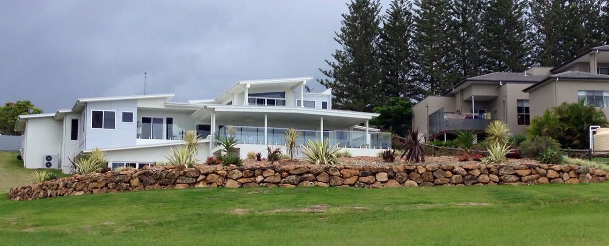 House With Manicured Lawn — Retaining Wall Builders in Northern Rivers, NSW