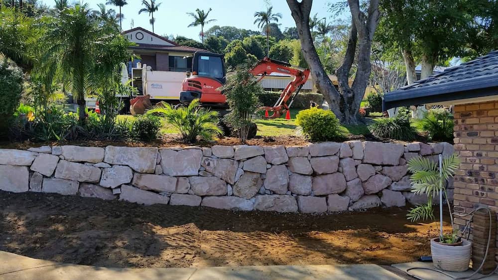 Excavator Near Retaining Wall — Retaining Wall Builders in Murwillumbah, NSW