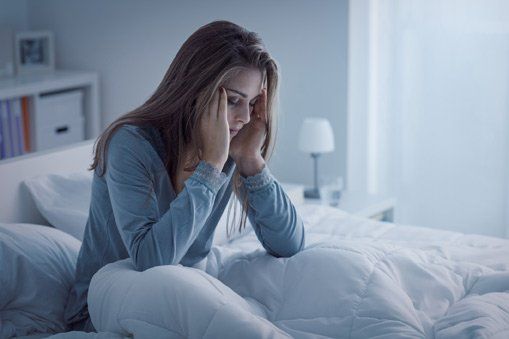 Woman Suffering from Insomnia Due to Allergy