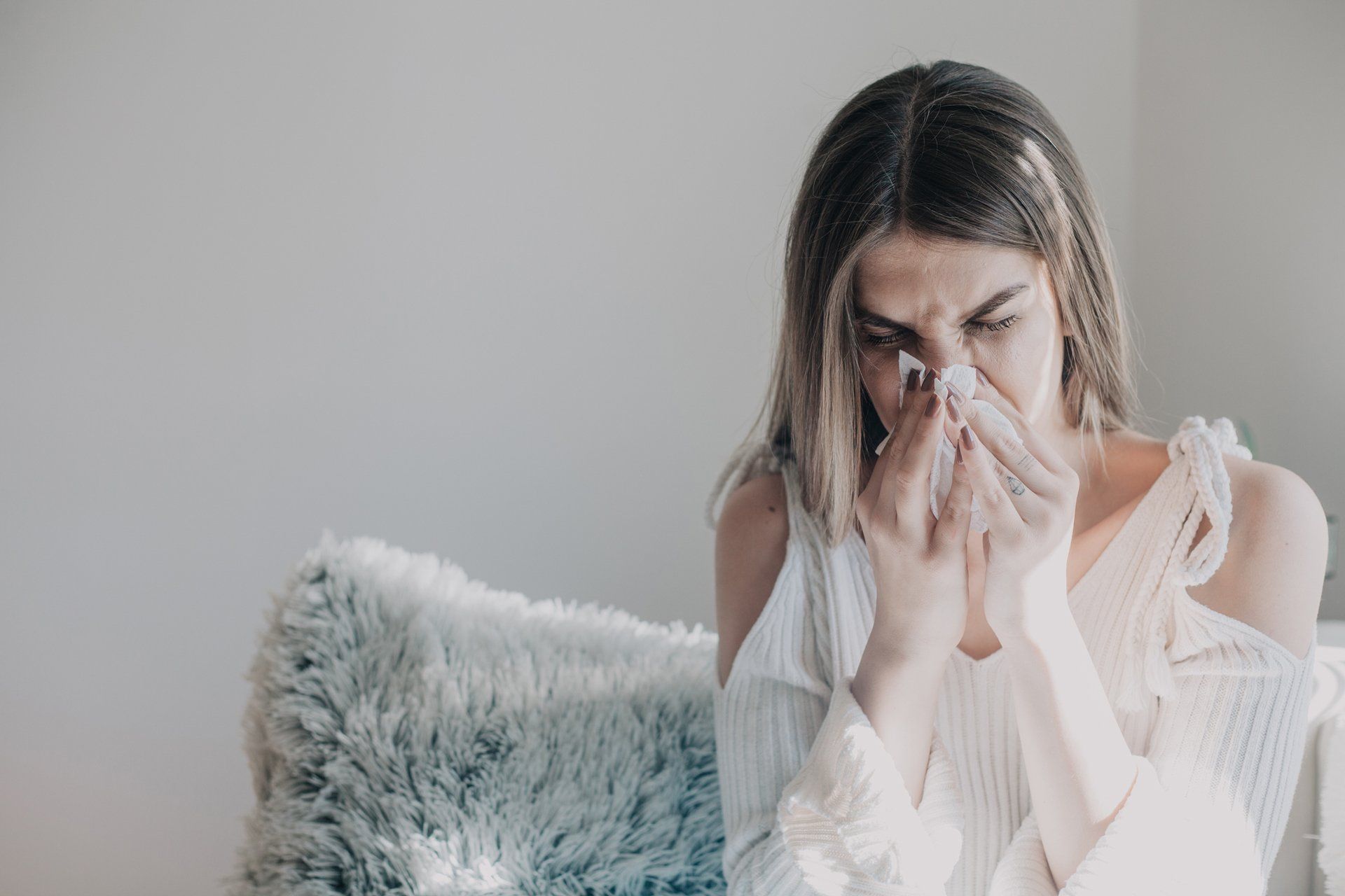 A woman having a sinus infection — Fort Worth, TX — Dr. James Haden