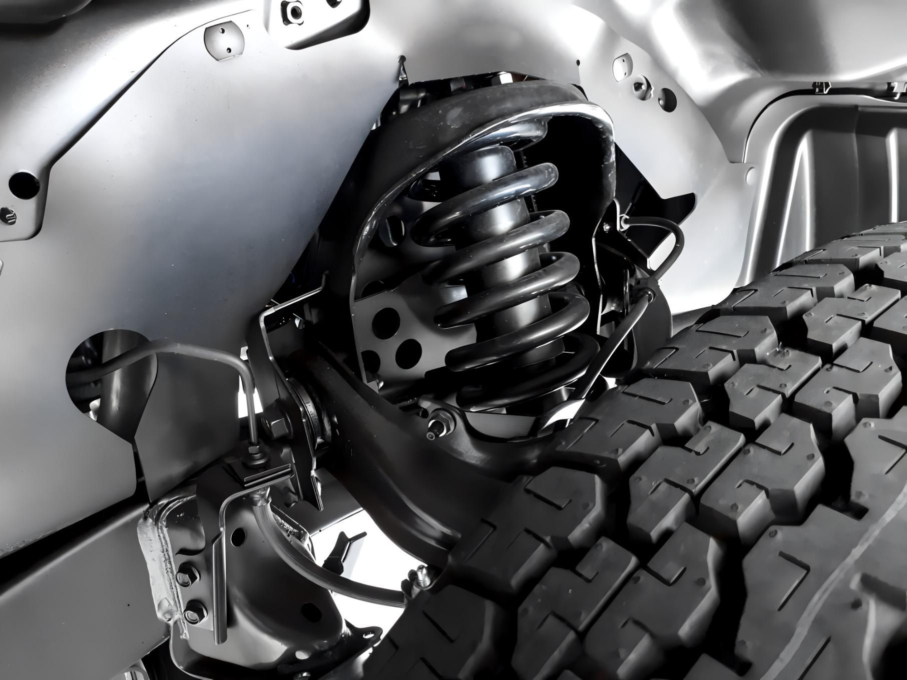 A Close Up of a Car Suspension With a Tire in the Background — CWC Auto Services In Dickson, ACT