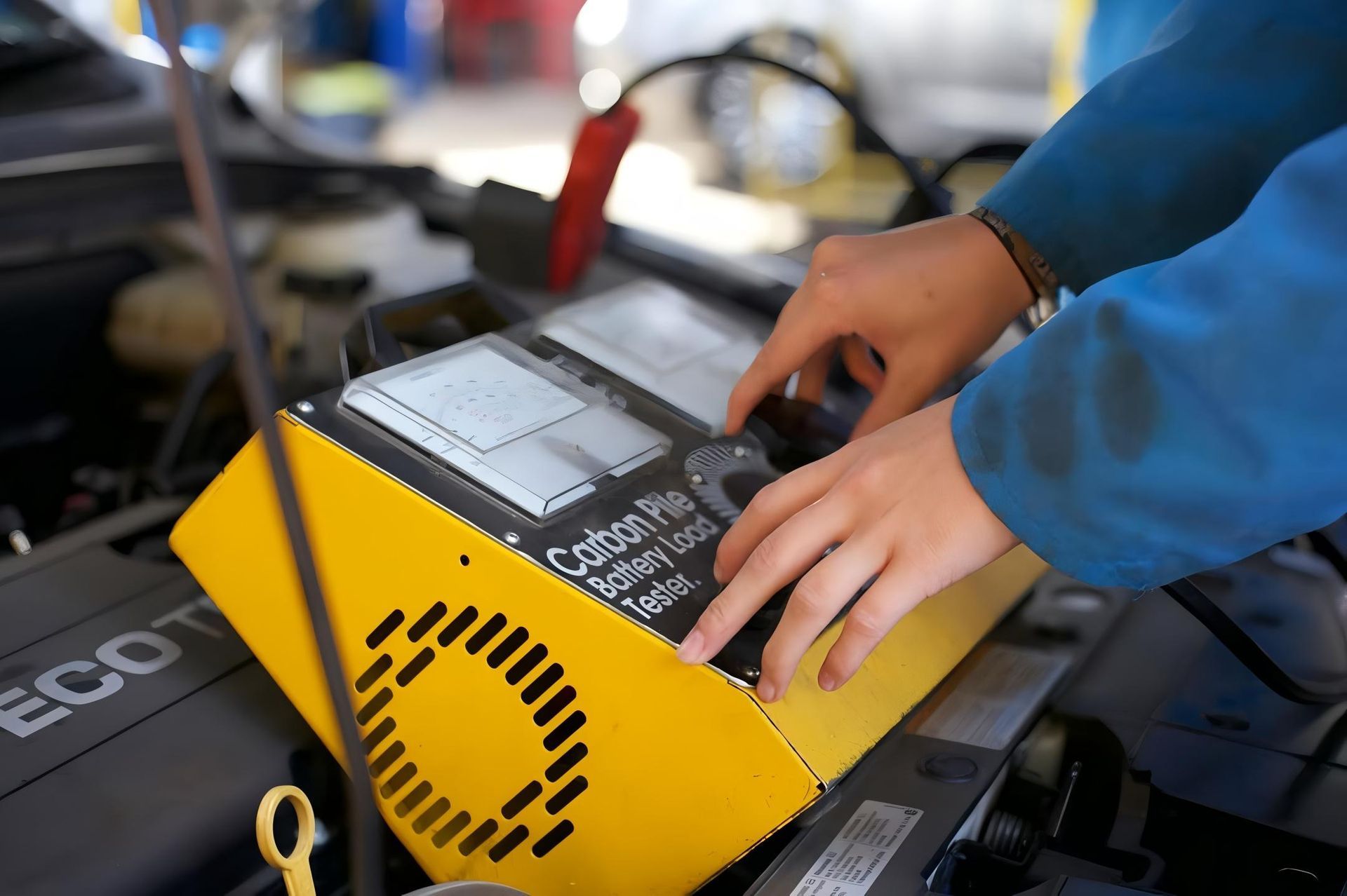 A Person is Working on a Car Battery Charger — CWC Auto Services In Ainslie, ACT