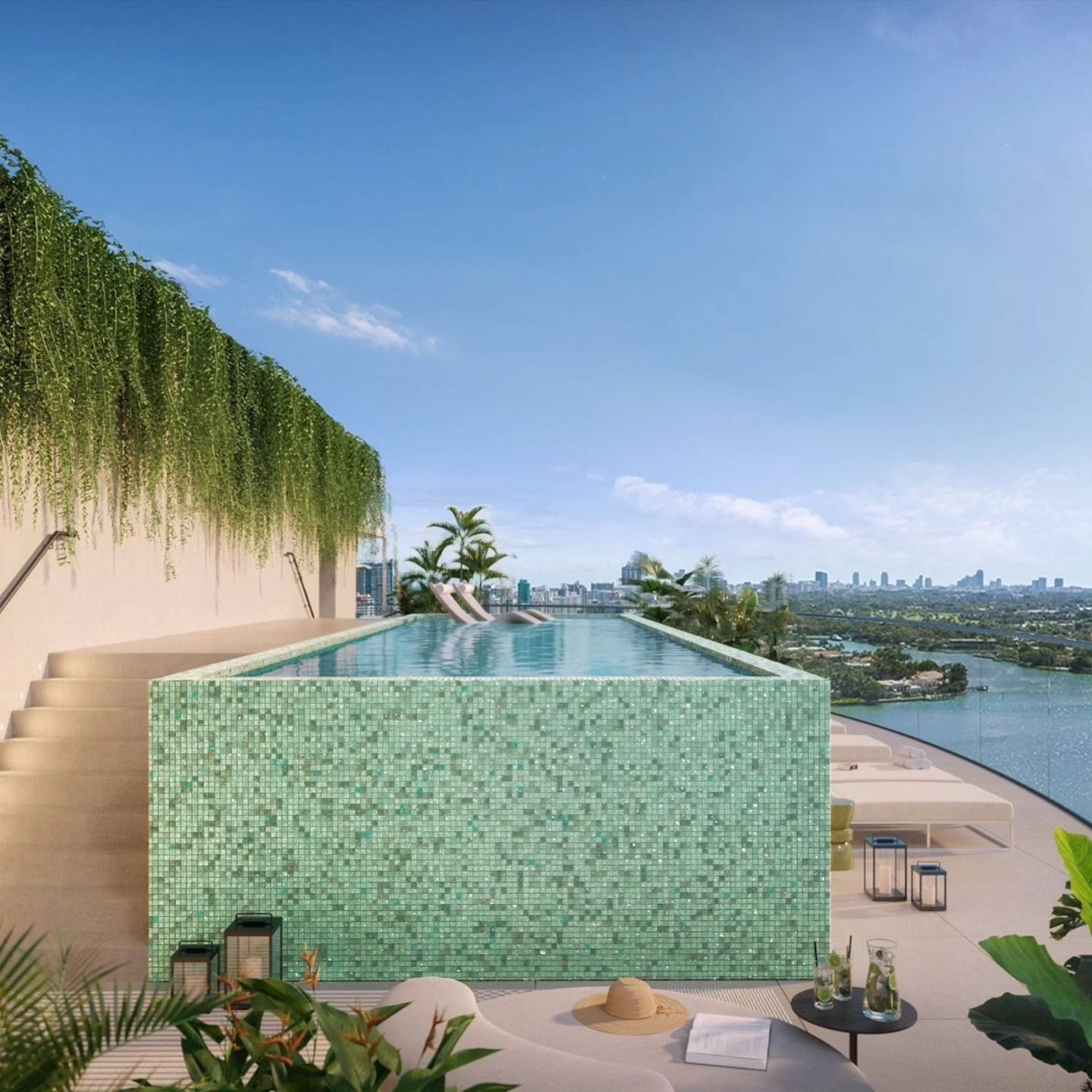 Rooftop infinity pool with turquoise tiles, lounge chairs, and city skyline views under a blue sky
