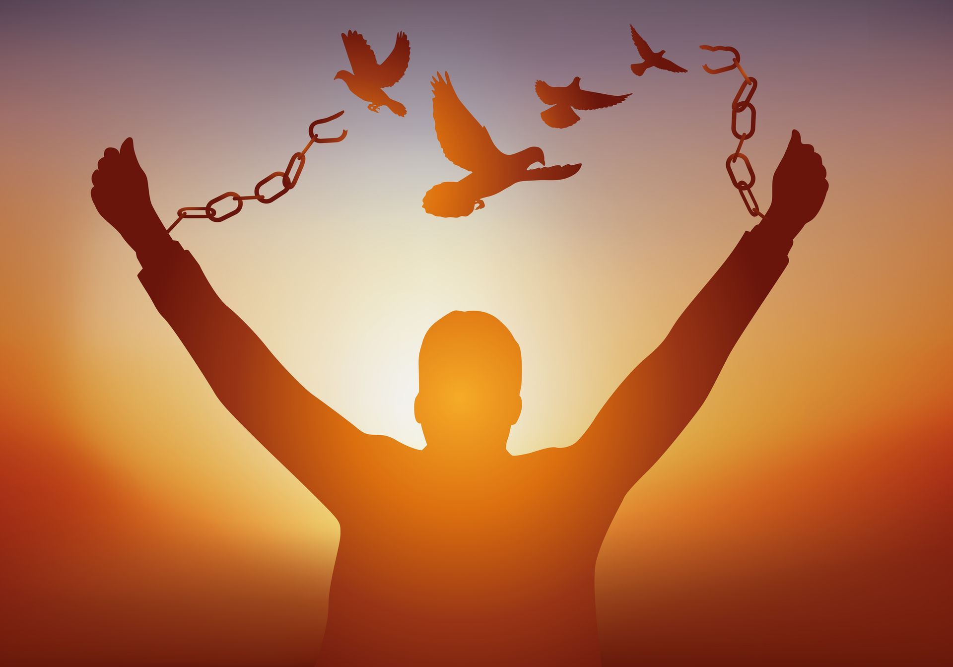 Silhouette of person breaking chains, arms raised with doves flying towards a colorful sunset.