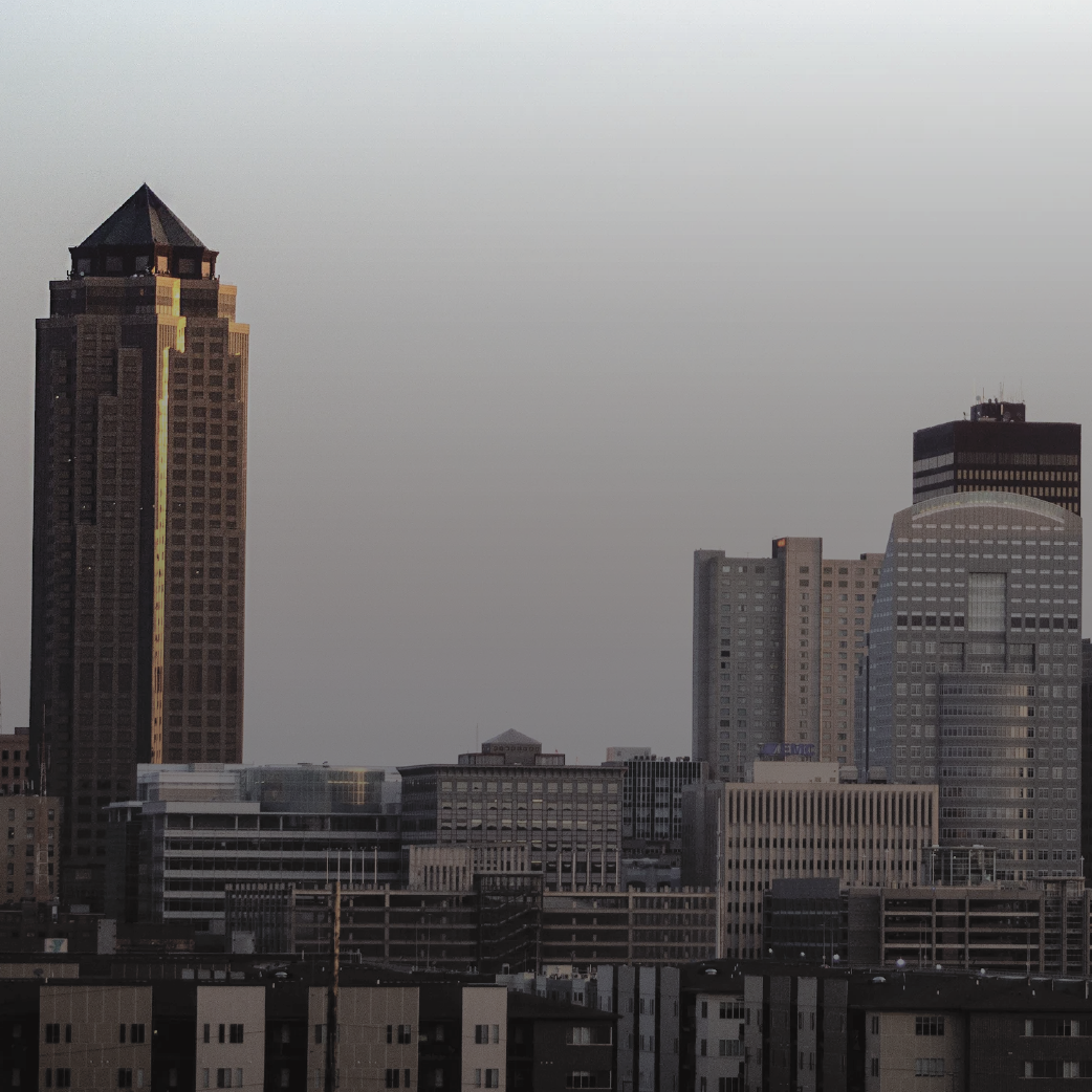 City skyline at dusk with tall buildings.