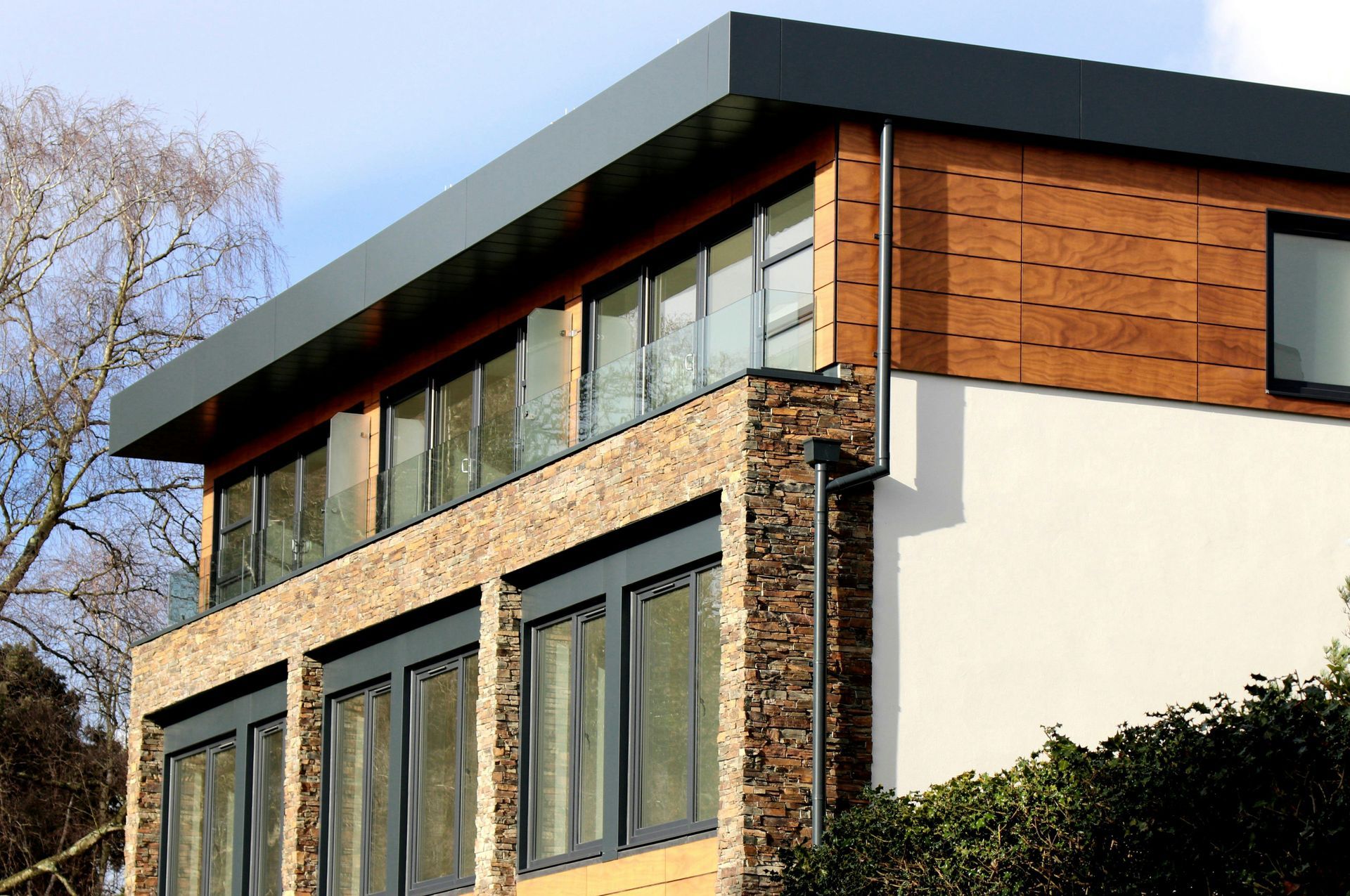 A large house with a lot of windows and a balcony