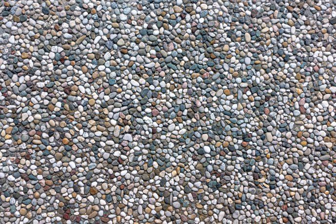 Small, Smooth Pebbles Form a Textured Surface — Comet Concreting in Drayton, QLD