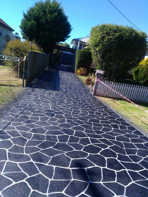 Black and White Patterned Driveway Leading to a House — Comet Concreting in Drayton, QLD