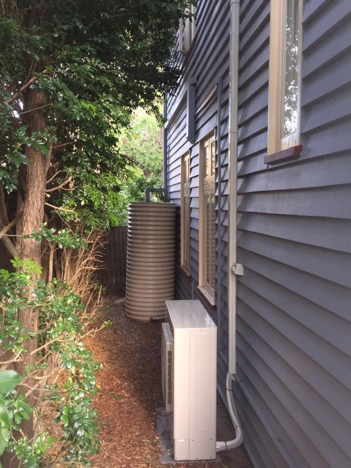 split-system-outside-unit-installed-aside-house-minimal-space