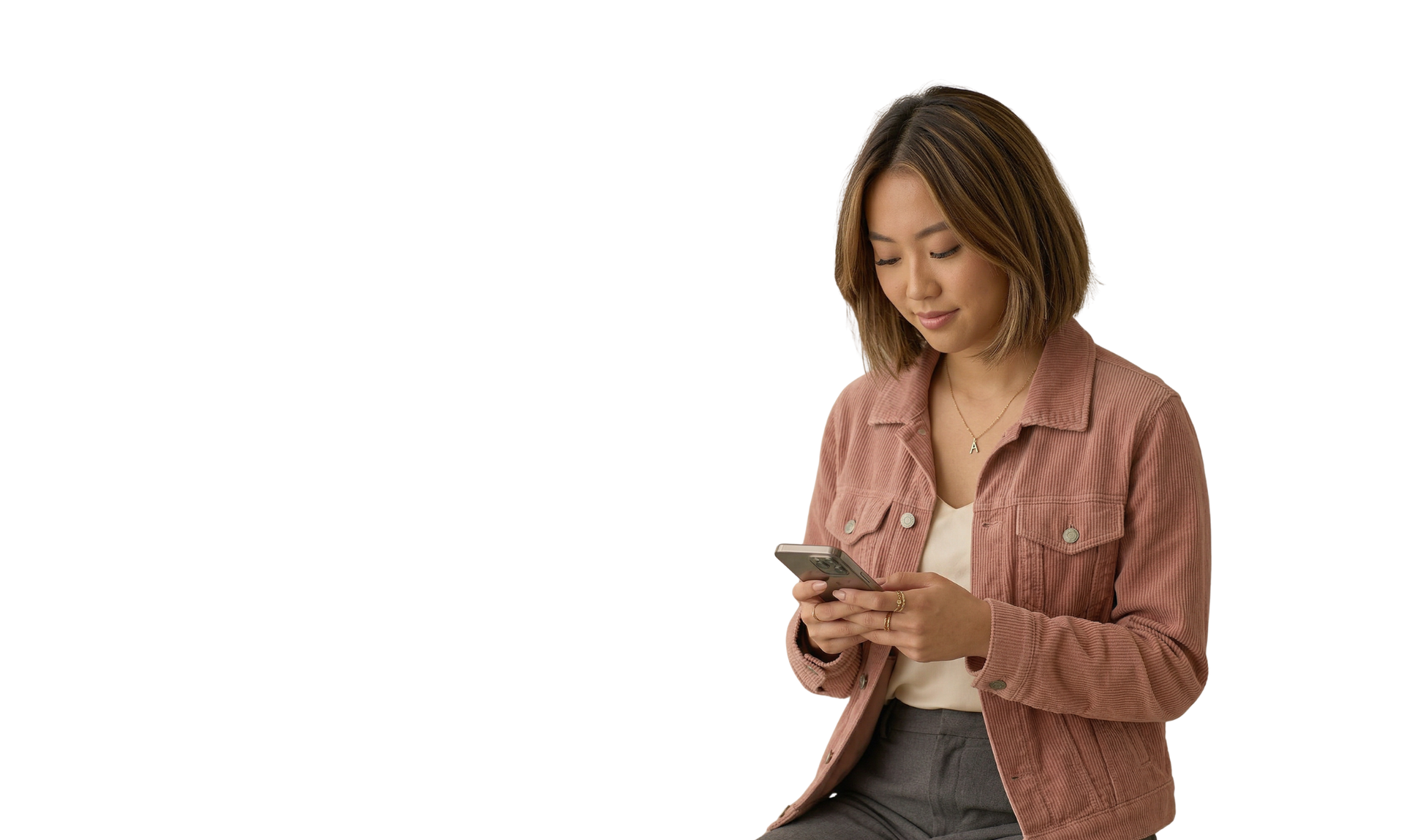 Woman in brown turtleneck, arms crossed, looking down, set against a neutral background.