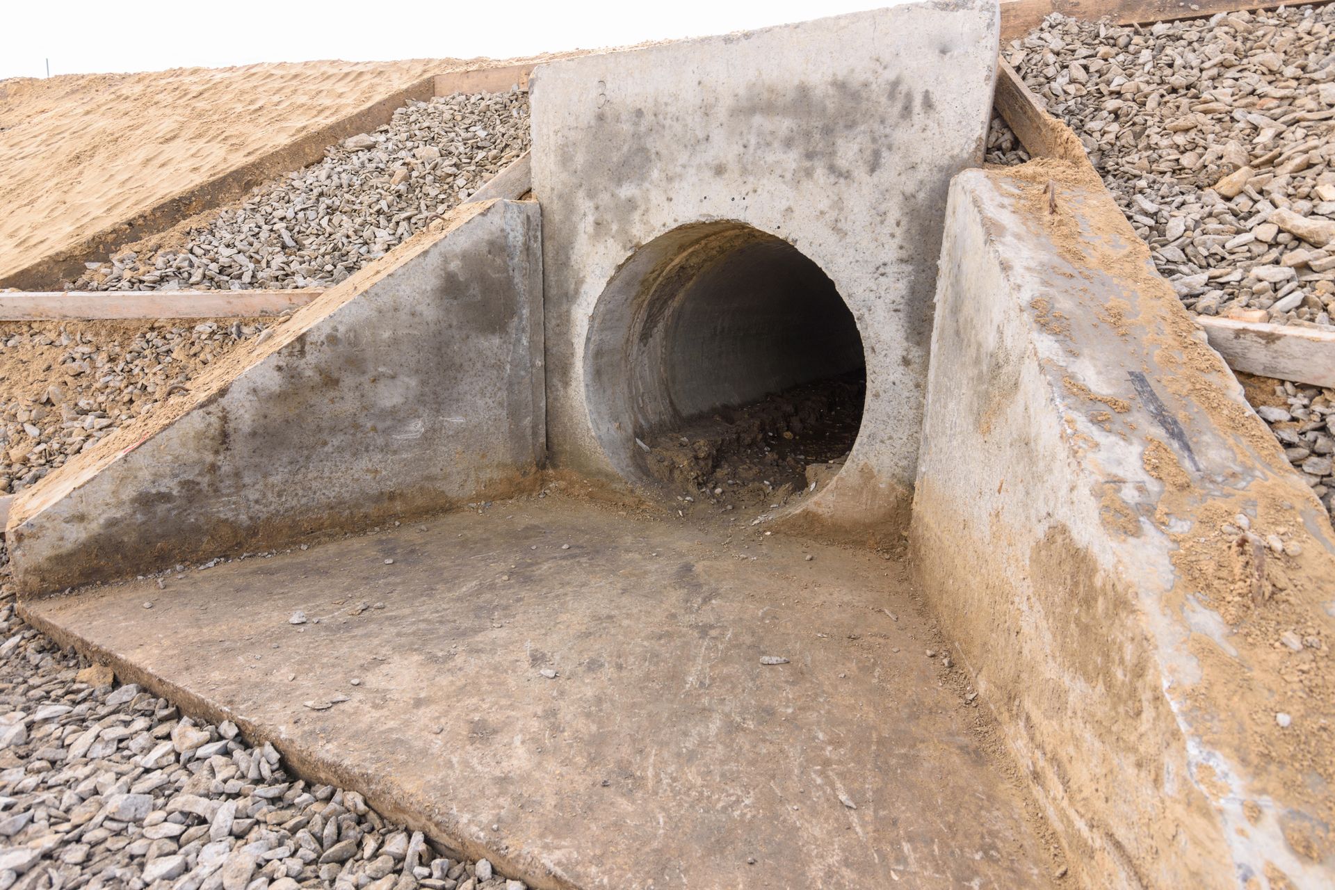 A concrete pipe with a hole in the middle of it