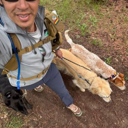 Andrew taking a selfie with a dog.