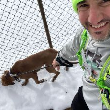 John taking a selfie with a dog on a hike