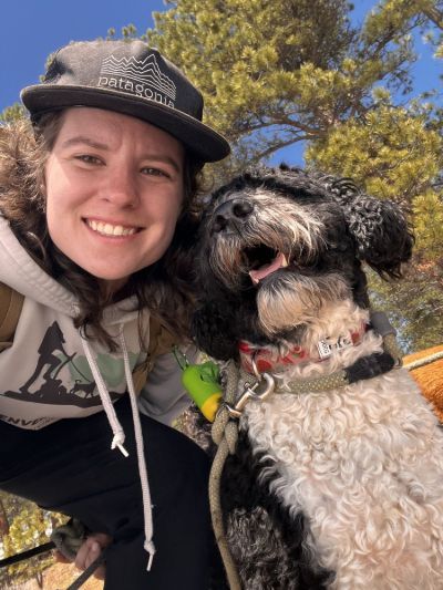 Emma taking a selfie with a dog