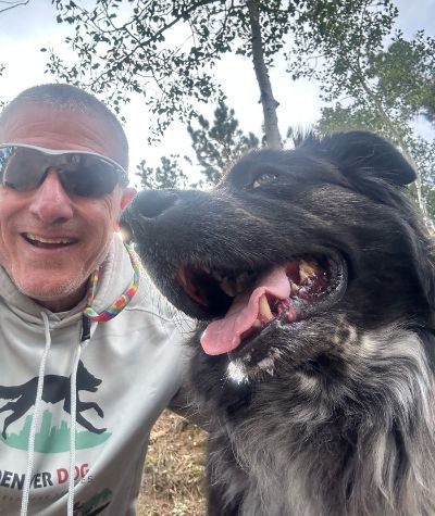 Michael on a hike with a dog